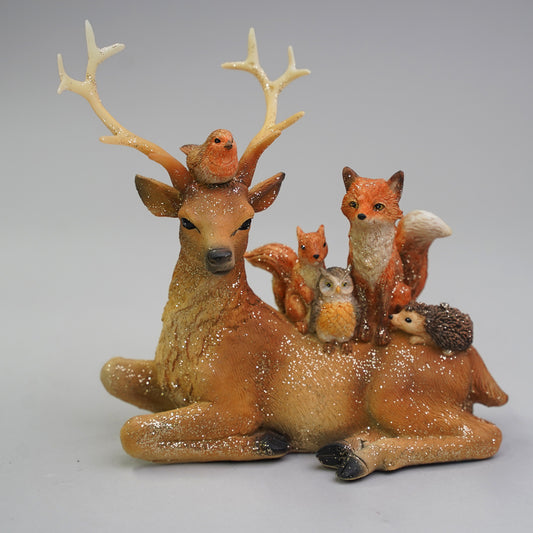 Med Sitting reindeer w/animals on his back 18.5x8.5x16.5cm
