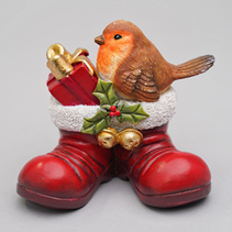 Robin sitting in Santas Boots